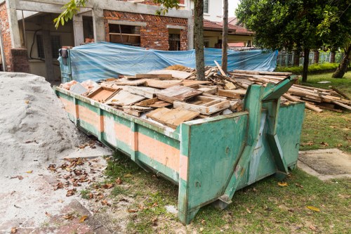 Homeowner assessing loft space for clearance